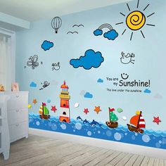 a child's room with a mural on the wall that says you are my sunshine