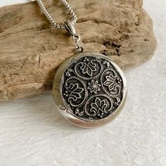 "Please note: If you need more than one, multiple quantities are available upon checkout. Timeless and classic, this gorgeous antiqued silver locket will become a special addition to your jewelry collection. Lightweight and beautiful with any neckline, dressed up or casual. The locket is 32mm in diameter, antique silver and opens for a secret place to keep pictures, messages, or whatever you like. The locket is plated brass and has a stainless steel rolo chain with a lobster clasp. You may choos Engraved Medallion Necklace As Gift, Engraved Round Pendant Medallion Necklace Gift, Engraved Medallion Necklace Gift, Engraved Medallion Necklace For Anniversary, Engraved Round Medallion Necklace For Anniversary, Engraved Round Medallion Necklace As Gift, Engraved Round Medallion Necklace Gift, Etched Round Pendant Medallion Necklace As A Gift, Etched Medallion Necklace With Round Pendant For Gift