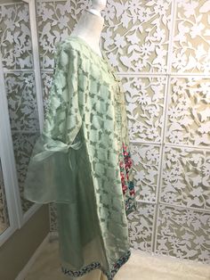 Very chic mint green jamawar on organza jacket, with bell sleeves and floral embroidery, it comes with silk matching inner, and ivory bell bottom. Brand: Bonita, Chen One Shipping USPS 2 day Green Bollywood Style Sharara For Formal Occasions, Bollywood Style Green Sharara For Formal Occasions, Formal Bollywood Green Sharara, Formal Green Semi-stitched Sharara, Green Dabka Lawn Suit For Party, Spring Designer Georgette Lawn Suit, Spring Festive Sets With Sheer Dupatta, Festive Sets With Sheer Dupatta For Spring, Spring Chanderi Sharara