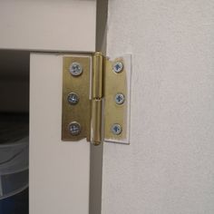 an open door with two knobs on it