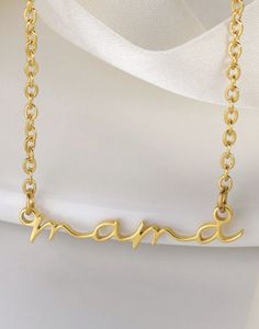 This gold dainty necklace features a thin chain for an simple look. The cursive mama font adds for a more personable look. Perfect for all our moms or soon to be moms. Add some of our HOJM earrings for a complete look. Great gift for mom. Size: 15 inch chain with a 3 inch extender Material: Gold plated over Stainless Steel Base. Tarnish and Water Resistant. Allergies: Hypoallergenic ALL SALE ITEMS ARE FINAL SALE Gold Dainty Necklace, Mama Necklace, Simple Look, Dainty Gold Necklace, Great Gifts For Mom, Dainty Necklace, Free Jewelry, Gift For Mom, Cleaning Household