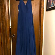 Navy Blue Pleated Floor Length Chiffon Dress With Split Front. Size 12 Perfect For Wedding Guest Or Bridesmaid. Vneck With Zipper In Back. Blue Chiffon V-neck Bridesmaid Dress, Blue V-neck Dress With Pleated Bodice, Blue A-line Chiffon Evening Dress, Blue Chiffon A-line Maxi Dress, Blue A-line Maxi Dress For Wedding Guest, Blue Floor-length Chiffon Bridesmaid Dress, V-neck Pleated Dress For Wedding Guest, Pleated V-neck Dress For Wedding Guest, Elegant Blue Chiffon Dress For Wedding Guest