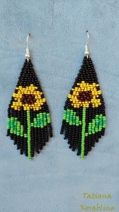 "These handmade unique earrings \"Sunflower\" are made of high-quality Czech beads and strong synthetic thread. I use my author's scheme . They are elegant, fashionable, and highly versatile, suitable for everyday wear. Color: black,yellow,brown,green . Copy without my permission is prohibited For those who want to buy my copyright scheme for these earrings: https://www.etsy.com/uk/listing/1056785837/brick-stitch-pattern-for-seed-bead?ref=shop_home_active_2 100% hand made with love! Measurements Black Dangle Earrings For Summer, Black Dangle Jewelry For Summer, Black Beaded Earrings For Summer Gifts, Black Beaded Earrings With Round Beads For Summer, Handmade Black Drop Flower Earrings, Handmade Black Drop Earrings, Handmade Adjustable Black Flower Earrings, Black Flower Jewelry For Summer, Bohemian Black Dangle Flower Earrings