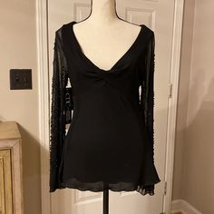 Women’s Black Top With Sheer Beaded Sleeves Nwt Size Medium Draped V Neck Sheer Beaded Flare Sleeves Pit To Pit 16” Smoke Free Home This Top Is Gorgeous, A Real Steal Glamorous V-neck Cocktail Tops, Embellished V-neck Top For Party, Embellished V-neck Party Top, Elegant Stretch Embellished Tops, Fitted V-neck Blouse For Evening, Embellished Black Tops For Cocktail, Embellished Blouse For Night Out, Stretch Embellished V-neck Tops, Embellished Stretch V-neck Tops