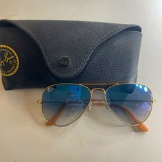 Gold Frame With A Blue Gradient Tint Worn Very Few Times, Perfect Condition, Comes With An Unopened Cleaning Towel And Case Classic Blue Aviator Sunglasses, Classic Blue Sunglasses For The Beach, Casual Blue Aviator Sunglasses, Classic Blue Aviator Sunglasses With Uv Protection, Classic Blue Aviator Sunglasses With Mirrored Lenses, Trendy Blue Aviator Sunglasses With Gradient Lenses, Classic Blue Tinted Aviator Sunglasses, Modern Blue Glass Aviator Sunglasses, Blue Aviator Sunglasses With Tinted Lenses