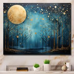 a painting on a wall with trees and moon in the night sky above it is a fireplace