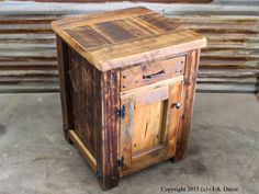 an old wooden cabinet sitting on concrete