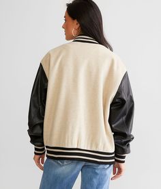 Gilded Intent Varsity Bomber Jacket - Black/Cream X-Small, Women's Beigeblack Brushed knit snap down lined jacket Faux leather contrast sleeves Striped trim Bust measures 47 on size small Body length 25 on size small Matching Mom & Me jacket. Layering piece(s) and/or accessories sold separately.. Shell: 90% Polyester 10% Rayon. Contrast: 100% Polyurethane. Lining: 100% Polyester. Rib: 97% Polyester 3% Spandex. Hand wash cold. Hang to dry. Do not bleach. Do not iron. Do not dry clean.. Measuremen Long Sleeve Varsity Jacket With Padded Collar For Fall, Black Spring Outerwear With Contrast Collar, Long Sleeve Varsity Jacket With Contrast Color For Fall, Varsity Style Long Sleeve Outerwear With Contrast Color, Fall Contrast Color Long Sleeve Varsity Jacket, Fall Leather Jacket For College, Sporty Fall Outerwear For College, Leather Jacket With Ribbed Cuffs For College In Fall, Varsity Leather Jacket With Long Sleeves For Winter