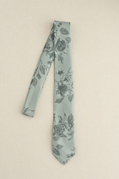 a blue tie with flowers on it