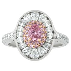 One of nature’s rarest treasures, the 0.32-carat natural fancy vivid pink diamond at the center of this ring displays a romantic pink hue. While pink diamonds come in an array of hues and tones, the very best are graded "fancy vivid” and display the intense saturation of this stone. The present example, which hails from the famed Argyle mines of Australia, is certified by the Gemological Institute of America (GIA) as being a natural fancy vivid pink diamond with VS2 clarity and even color distri Golconda Diamond, Pink Diamond Ring, Colored Diamond Rings, Pink Diamonds, Pink Accessories, White Diamond Ring, Ring Displays, Expensive Jewelry, Fine Jewels