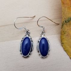 Hello, Welcome to our shop Q925jewelry.etsy.com and hope you enjoy shopping here! *sterling silver earrings *hook earrings *blue lapis *size and shape of stone in mm: 14x7 oval *color: blue *materials: made from sterling silver .925 *southwestern designs *simple **size of a penny in picture: 19mm **size of a quarter dollar: 24.25mm **please compare our jewelry items with those coins for getting some ideas with the sizes of individual parts or jewelry item **all of our jewelry are made in quantit Blue Bohemian Sterling Silver Earrings, Nickel-free Blue Southwestern Earrings, Blue Sterling Silver Oval Jewelry, Blue Oval Sterling Silver Jewelry, Southwestern Blue Drop Earrings, Southwestern Style Blue Drop Earrings, Nickel Free Blue Southwestern Jewelry, Blue Nickel Free Sterling Silver Earrings, Southwestern Style Sterling Silver Drop Earrings