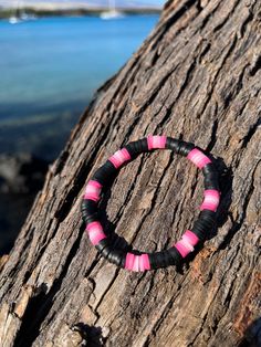 A high quality, durable bracelet made with pink ombré and black heishi clay beads! All bracelets are 6.5-7 inches, unisex, and stretchy. Although they can withstand a lot, always handle them with care! When putting them on gently roll it on and to preserve the quality avoid wearing them swimming. Cheap Pink Polymer Clay Bracelets, Trousers Outfit Ideas, Beaded Bracelet Ideas, Make Clay Beads, Girly Bracelets, Colorful Bead Bracelets, Clay Bead Necklace, Beaded Braclets, Craft Home Decor