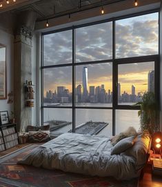 a bedroom with a large window overlooking the city at sunset or sunrise, and a bed in front of it