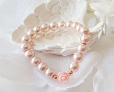 Flower girl bracelet, blush pink flower girl gift, pink rose bracelet, pearl bracelet, blush pink pearl bracelet, jr bridesmaid gift This blush pink flower girl bracelet is made with blush pink color little glass pearls (8 mm) and soft pink resin rose charm. This stretch pearl bracelet is perfect gift for your flower girls, jr bridesmaids or bridesmaids. Please visit my store to see the other wedding jewelry https://www.etsy.com/shop/asteriasbridal Pink Pearl Bracelet For Wedding, Delicate Pink Bracelets For Wedding, Delicate Pink Bracelet For Wedding, Delicate Pink Pearl Bracelet For Wedding, Feminine Rose Gold Bracelets For Wedding, Adjustable Pink Pearl Bracelet For Weddings, Dainty Pink Beaded Bracelets For Wedding, Pink Adjustable Bracelets For Bridesmaids, Feminine Pink Pearl Bracelets