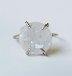 This beautiful vanilla off - white druzy gemstone features a subtle sparkle. Set in 14k gold fill, this ring has a delicate hand forged band and is a perfect for everyday wear or as a statement piece. Gemstone is approx. 10mm in diameter.Please note, this ring is made after order. Please leave your ringsize at checkout.Due to the nature of this stone, each piece can vary in color/shape. My QUALITY:Gold filled pieces contain 100+ times more real gold than gold plated pieces. They are durable and Engagement Ring Raw, Crystal Engagement Ring, Crystal Engagement Rings, Raw Stone Ring, April Birthstone, White Crystals, Gold Filled Ring, Everyday Rings, White Crystal