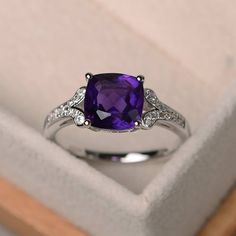 Cushion Cut Amethyst Ring For Formal Occasions, Purple Cushion Cut Ring With Center Stone, Formal Amethyst Cushion Cut Rings, Purple Diamond Cushion Cut Rings, Purple Cushion Cut Diamond Rings, Fine Jewelry Cushion Cut Amethyst Ring, Cushion Cut Purple Amethyst Ring, Elegant Cushion Cut Amethyst Ring, Fine Jewelry Purple Cushion Cut Amethyst Ring