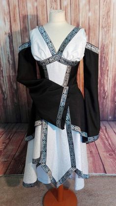 Celtic priestess Dress Black And White Witch Outfit, Gothic Medieval Dress For Costume Party, Medieval Style Dress For Costume Party, Medieval Style Dresses For Festivals, Black Elven Costume Dress, Medieval Long Sleeve Dress For Cosplay, Fitted Elven Style Festival Dresses, Black Elven Medieval Dress For Costume Party, Black Elven Medieval Dress For Medieval Festivals