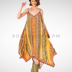 Yellow Orange Boho Print Midi Dress Shark Bite Hem V Neck Spaghetti Straps As Effortless As It Is Essential, This Everyday Boho Chic, Multi Color Hanky Dress Will Be Your Go To. It’s Luxuriously Soft, Light Weight, Stylish & On Trend. It Looks Great With A Denim Jacket & Boots Or Dressed Up With Heels. Features Relaxed Flowing Fit Multi Print, Multi Color Adjustable Spaghetti Straps V Neckline, Front & Back Flattering On Many Body Types Handkerchief Asymmetrical Hemline 100% Rayon Model In Green Bohemian Sleeveless Slip Dress For Spring, Spring Season Bohemian Sleeveless Slip Dress, Multicolor Flowy Maxi Dress With Spaghetti Straps, Flowy Multicolor Maxi Dress With Spaghetti Straps, Yellow Summer Slip Dress With Spaghetti Straps, Bohemian Beach Slip Dress With Spaghetti Straps, Bohemian Spaghetti Strap Slip Dress For Beach, Spring Bohemian V-neck Slip Dress, Multicolor Spaghetti Strap Midi Dress For Vacation