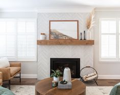 a living room filled with furniture and a fire place in front of a painting on the wall