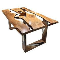 a table made out of wood and metal with an abstract design on the top is shown