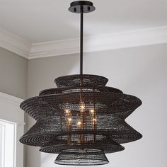 a black chandelier hanging from the ceiling