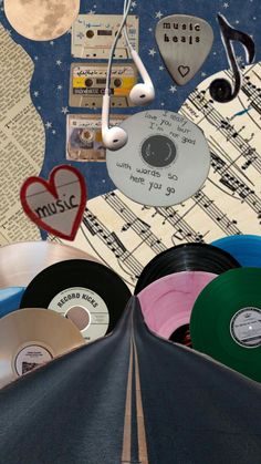 many different colored records are in the shape of a heart and some music notes on them