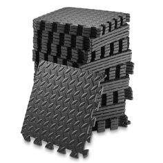 three pieces of black foam stacked on top of each other