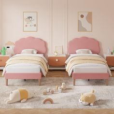 two twin beds with pink headboards and white sheets in a child's bedroom