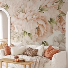 a living room with flowers on the wall