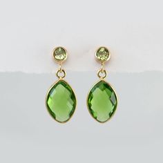 "Peridot Earrings - August Birthstone Earrings - Gold Earrings - Small Drop Earrings - Post Earrings - Green Earrings A pair of stunning Peridot drops earrings. The earring posts are 14k gold filled or sterling silver with beautiful bezel set stone. Earrings measure approx 0.75 inches long. Stones are 8mm x 12mm. Available in: Peridot Quartz Citrine Quartz Garnet Quartz Because I use natural stones, the stones may vary slightly in shape, shade and size. Earrings will be shipped wrapped in a Dele Green Faceted Earrings For Anniversary, Elegant Lime Green Earrings For Gift, Green Peridot Earrings For Anniversary, Peridot Drop Earrings For May Birthstone, Peridot Earrings For May Birthstone Gift, Green Teardrop Birthstone Earrings, Peridot Earrings Studs, Jewelry Gold Earrings, Schmuck Gold