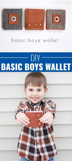 a young boy is holding up his wallet