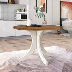 a white and wood table in a living room