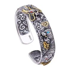 You've been a warrior for a long time and deserve something that will make you feel like one.This Feng Shui Dragon Fortune Bangle is the perfect gift for your modern-day warrior. The dragon is one of the most well-known symbols in feng shui, representing abundance, success, and good luck. Wearing this bangle will help you feel confident and powerful!This Feng Shui Dragon Fortune Bangle was made from copper, handcrafted by an artisan who took his craft seriously—and then adjusted it to fit all sizes as it has an adjustable opening. This might be the lucky bangle you've been longing for. Make sure to get one for yourself or your loved ones. Silver Spiritual Bracelets, Silver Spiritual Bracelet For Gifting, Spiritual Silver Bracelet Gift, Feng Shui Dragon, The Dragon, Feel Confident, Your Soul, You've Been, Feng Shui