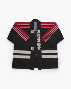 Carefully selected and imported from Japan, this product is truly one of a kind. Once it is sold, no other will be in the same style. This product belongs solely to you. Firefighter jackets like this one are styled after Edo firefighters, or Hikeshi, from 1603-1867. The front of the jacket displays the person’s rank, while the emblem on the back displays the unit. The stripes on the bottom of the coat also indicate what area that unit is from. The Edo Firemanship Preservation Association was est Ceremonial Stand Collar Outerwear For Winter, Ceremonial Winter Outerwear With Stand Collar, Traditional Black Ceremonial Outerwear, Black Long Sleeve Ceremonial Outerwear, Traditional Black Stand Collar Outerwear, Traditional Black Outerwear With Stand Collar, Traditional Black Cotton Outerwear, Black Ceremonial Outerwear For Fall, Fireman Jacket