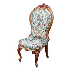 an ornately decorated chair is shown against a white background