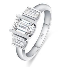 a white gold ring with three baguettes on it