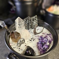 a bowl filled with lots of different types of crystals