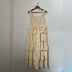 Beautiful Ruffled Dress. Purchased For Easter And Didn’t Wear It. Never Worn! Pale Yellow. Size Medium. Tiered Dress With Ruffles For Day Out, Sleeveless Tiered Dress With Layered Hem For Brunch, Daywear Tiered Sundress, Cream Tiered Midi Dress With Ruffle Hem, Tiered Ruffle Midi Dress For Garden Party, Beige Ruffled Tiered Midi Dress, Tiered Ruffle Dress For Day Out, Tiered Ruffle Dress For Daywear, Cream Tiered Skirt Dress For Brunch