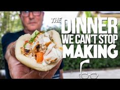 a man holding up a sandwich in his hand with the words dinner we can't stop making