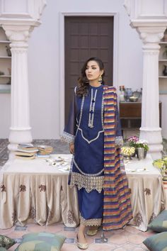 Brand: La RosaaProduct Code: LE-24-03Collection: La Rosaa Spring Summer Ready to Wear CollectionFabric: Khaadi Net DESIGN DETAILS: Indulge in the epitome of refined elegance with our Navy Blue 3-piece outfit, meticulously designed to enchant and inspire. The intricately crafted shirt is meticulously fashioned from the finest Khadi net. Its Ban collar exudes sophistication, while the embellished plaquette steals the spotlight with its mirror accents and graceful tassels. But the beauty doesn't st Blue Georgette Lawn Suit For Festivals, Traditional Drape Blue Lawn Suit For Eid, Blue Silk Lawn Suit With Intricate Embroidery, Festive Blue Georgette Lawn Suit, Blue Georgette Lawn Suit For Festive Occasions, Blue Unstitched Dabka Suit In Georgette, Blue Georgette Unstitched Suit With Dabka, Bollywood Style Blue Lawn Suit With Intricate Embroidery, Blue Bollywood Lawn Suit With Intricate Embroidery