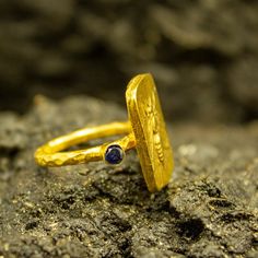 Roman Coin Ring | 24K Gold Plated | CZ Stone Silver Ring | Ionia Ephesus Coins Ring | Ancient Art Greek Silver Ring | Zeus Ring Our shop offer free ring sizing and color options.(Oxidized(Black),Gold Plated) Handcrafted hammered full round ring band size measures 2mm in width and 24k gold plated bronze coin 19x13 mm. Metal : 925 Sterling Silver Band Width : 2 mm Gem Stone : Navy Blue Diamond Cut Cubic Zirconia Gem Color : Green,Navy Blue,Purple,Blue,White,Red (The color you want is made for free Gold Sapphire Spiritual Promise Ring, Spiritual Gold Sapphire Promise Ring, Handmade Gold Sapphire Open Ring, Handmade Gold Open Sapphire Ring, 22k Gold Byzantine Style Rings As Gift, Handmade Gold Sapphire Ring For Anniversary, Hammered Jewelry, Roman Coins, Coin Ring