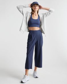 These look like classic work pants, but move like your favorite activewear. Our cropped Performance Tech Wide Leg Commuter Pants have just the right amount of stretch for days when you’re on the go, plus the sun protection and quick-dry properties of top-notch performance wear. And they look great with sneakers.  | Quince | Women's Performance Tech Wide Leg Pants in Navy, Size XS, Recycled Polyester High Stretch Go-dry Athleisure Pants, Compressive Sportswear Pants With Go-dry, Compressive Go-dry Sportswear Pants, Workout Yoga Pants With Pockets And 4-way Stretch, Compressive Sportswear Pants With Go-dry Technology, 4-way Stretch Yoga Pants With Pockets For Workout, Functional Yoga Pants With Pockets And 4-way Stretch, Sporty Ankle-length Comfort Stretch Sweatpants, Casual High Stretch Yoga Pants With Side Pockets