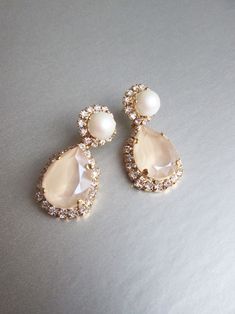 Pastel Ivory Cream Bridal Crystal Earrings Crystal and Pearl - Etsy Cream Pearl Drop Earrings For Wedding, Elegant Beige Earrings For Wedding, Cream Pearl Drop Earrings For Formal Occasions, Cream Dangle Earrings For Wedding, Beige Drop Earrings For Wedding, Cream Teardrop Pearl Drop Jewelry, Delicate Pearl White Teardrop Bridal Earrings, Elegant Cream Pearl Drop Earrings, Cream Teardrop Earrings For Wedding