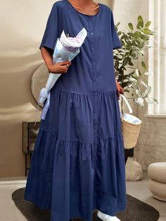 a woman in a blue dress holding a basket Blue A-line Maxi Dress For Daywear, Non-stretch Blue Maxi Dress, Blue Cotton A-line Maxi Dress, Blue Button-up Maxi Dress With Button Closure, Blue Rayon V-neck Maxi Dress, Textile Waste, Navy Blue Dress, Navy Blue Dresses, Blue Dress