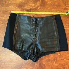 80’s Vintage Leather & Scuba Neoprene Hot Shorts Zippered Back, Tie Front. Lined. Stretchy Neoprene Side Panels With Leather. Size Large But Due To Vintage Styling Runs Very Small. This Piece Is Fire! Vintage Styling, Hot Shorts, Side Panels, Vintage Leather, Panel Siding, High Waisted, Womens Shorts, Pants, Leather