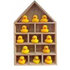 a wooden shelf filled with yellow rubber ducks