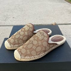 Coach Casual Brown Mules With Textured Sole, Casual Beige Flat Heel Mules, Casual Beige Closed Toe Mules, Brown Closed Toe Mules With Textured Sole, Casual Flat Mules With Textured Sole, Beige Round Toe Mules With Textured Sole, Beige Textured Sole Round Toe Mules, Casual Almond Toe Sandals Medium Width, Coach Casual Slip-on Sandals