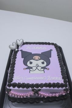 a square cake decorated with an image of a cat