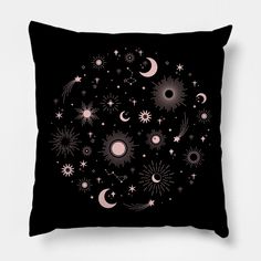 a black pillow with stars and planets on it