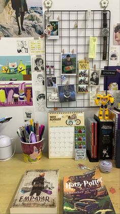 the desk is cluttered with books, pens and magnets on it's wall